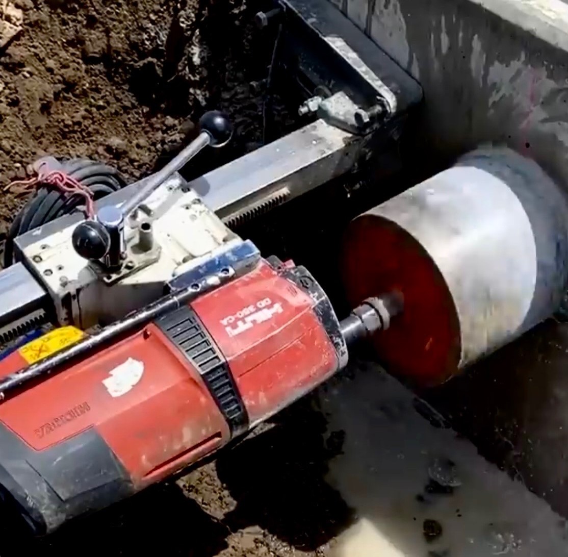 Concrete core drilling in action on a job site